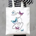 White canvas tote bag featuring a vibrant multi-color butterfly print for women - Gradient Butterfly Stars Style (3)