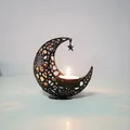 Black crescent moon metal candle holder with star hollow patterns for Ramadan decoration. - Black