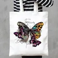 Stylish white canvas tote bag featuring a vibrant and colorful butterfly graphic print - Colorful Butterfly and Text Style (16)