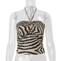 Detailed view of the zebra print and sequin embellishments on the halter top - L / Tops / Khaki