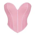Dettaglio del corsetto rosa con scollo a cuore e profili verticali decorativi - Rosa