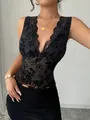Close-up of black floral flocking mesh tank top with elegant lace V-neck detail - S / Tops / Black