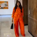 Stylish women's two-piece set with orange floral shirt and matching wide-leg pants. - S / Top And Bottom / Orange