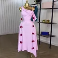 Elegant one-shoulder midi dress in pink with red bow decorations on gold mannequin. - S / Dresses / Pink