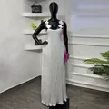 White pleated maxi dress featuring 3D floral straps and an elegant backless design. - S / Dresses / White