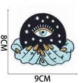 Close-up detail of mystic witch evil eye embroidery patch with stars and crystal ball - Evil Eye Crystal Ball (C31GS-28-01)