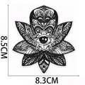 Detailed macro view of black and white evil eye embroidery patch showing size dimensions - Symmetrical Evil Eye (C31GS-17-04)