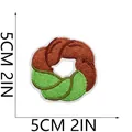 Close-up detail of a colorful donut-shaped embroidered patch with 5cm size markings. - Twist Donut (C10TD-095-07) / 5x5cm