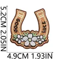Detailed view of 5.2x4.9cm cowboy horseshoe embroidered patch with Good Luck text - Good Luck Horseshoe Style (X11BM-095-49) / 5.2cmx4.9cm