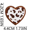 Detailed macro view of a brown cow print heart embroidered patch with dimensions. - Cow Print Heart Style (X11BM-068-51) / 4.2cmx4.4cm