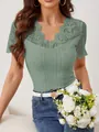 Elegant sage green short sleeve top featuring scallop V-neck and lace patchwork detail - Ocean Green