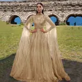 Stunning gold sequin formal gown with elegant long mesh cape sleeves for events - S / Dresses / Gold