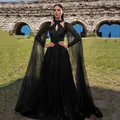 Elegant black mesh evening gown with sequins and dramatic floor-length mesh sleeves. - S / Dresses / Black