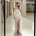 Detailed view of the intricate lace and bone structure of this white strapless evening gown - S / Dresses / White