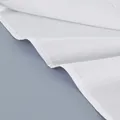 Detailed view of white cotton fabric and neat stitching on long sleeve French shirt - S / Tops / White