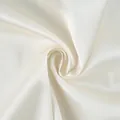 Close-up of elegant ivory satin fabric showing smooth texture and high-end soft sheen - S / Tops / Apricot