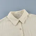 Close-up shot of elegant cream linen shirt collar with button and soft fabric texture - S / Top And Bottom / Apricot