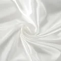 Detailed macro view of glossy white satin fabric showing smooth texture and luster - S / Tops / White