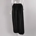 Back view of elegant black satin lantern pants featuring a draped pleated design on mannequin - S / Bottoms / Black
