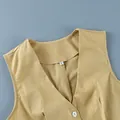 Close-up detail of the V-neckline and size S tag on a mustard yellow cotton linen vest. - S / Top And Bottom / Yellow