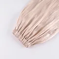 Close-up of the elasticized cuff and textured satin fabric on beige lantern pants. - S / Bottoms / Apricot