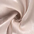 Close-up macro view of the shiny champagne fabric texture for casual lantern pants. - S / Bottoms / Champagne