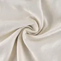 Close-up detail of high-quality beige satin fabric showing smooth drape and texture - S / Bottoms / Apricot