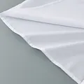 Detailed macro close-up showing fine stitching on a white cotton office commute shirt - S / Tops / White
