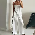Elegant white two-piece satin lounge set with lace-trimmed camisole and wide-leg pants - S / Top And Bottom / White