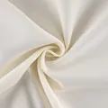 Close-up of cream white frosted velvet fabric with fine ribbed texture for trench coats - Off White