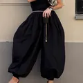 Detailed view of stylish black voluminous harem balloon pants with cinched ankles - S / Bottoms / Black