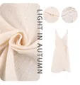 Detailed macro view of crinkled gauze fabric texture and the elegant wrap dress design - S / Dresses / White