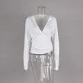 Detail view of white V-neck wrap long sleeve top featuring a slim fit for Pilates yoga - S / Tops / White