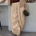 Stylish beige balloon pants for women featuring wide-leg cut and gathered ankle design - S / Bottoms / Khaki