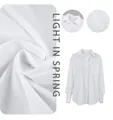 Detailed view of the lightweight fabric texture and collar on a white oversize button-down shirt - S / Tops / White