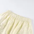 Close-up detail of the elastic waistband on loose shimmery pale yellow lantern pants - S / Bottoms / Beige