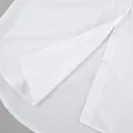 Detailed macro view of minimalist white oversized boyfriend shirt hem and buttons - S / Tops / White