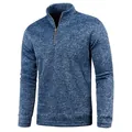 Close-up detail of a men's blue marled quarter-zip pullover with a high stand collar - Navy Blue