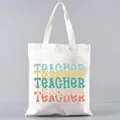 Detailed close-up of a white canvas tote bag featuring colorful printed Teacher text - Teacher Colorful Text (4) / 39cm*35cm