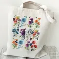 White canvas tote bag featuring vibrant floral and butterfly prints for daily shopping. - Floral and Butterfly (STD2097-A) / White