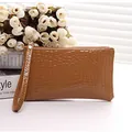 Elegant brown crocodile pattern leather clutch bag with a convenient wrist strap for women - Brown