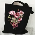 Black canvas tote bag featuring a vibrant pink floral print and bow detail - Pink Purple Flower Cluster (STD2097-X Black)