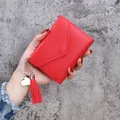 Red lychee grain wallet for women with elegant tassel and gold heart pendant decoration - Red