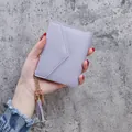 Elegant lavender purple lychee pattern small wallet featuring a stylish tassel keychain - Purple