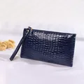 Elegant navy blue crocodile-embossed women's clutch bag with wristlet strap and gold zip - Dark Blue
