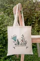 Close-up of the No Rain No Flowers floral print on a natural canvas tote bag - 35*40cm / Colorful Floral With Text Print (2)