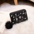 Elegant black short zip wallet with pink floral embroidery and black fur ball charm - Black