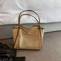 Handmade woven straw tote bag in beige with dark brown handle straps SKU display - Brown