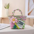 Hand-woven pink and green gift basket tote featuring a plush flower and Good Luck tag - Decorated / Small (Bottom 16x15x9cm, Top 22cm) / Pink Green Contrast