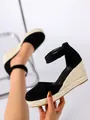 Detail shot of black suede espadrille wedge sandals with rope platform and ankle strap. - 38 / Black